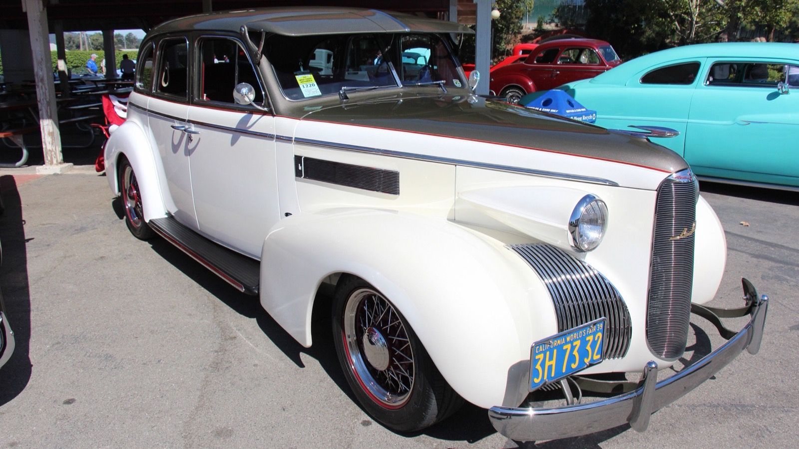 1939 LaSalle Series 50 sedan in white with grey roof, front three-quarter view
