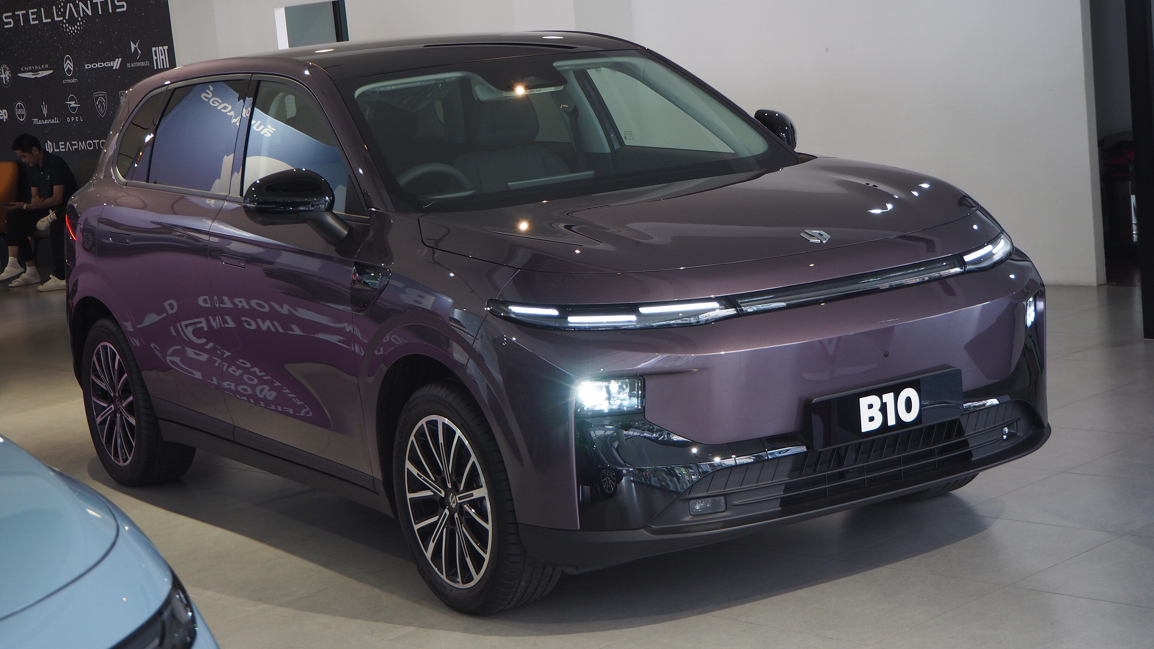 Purple 2025 Leapmotor B10 compact SUV on a Stellantis display stand, front three-quarter view