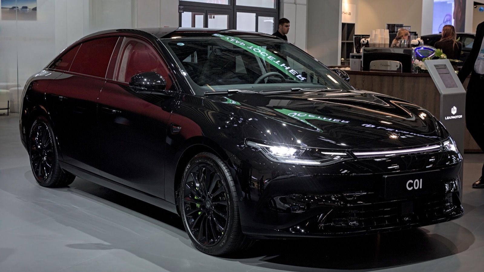 Black Leapmotor C01 electric saloon on the Leapmotor stand at the IAA 2023, front three-quarter view