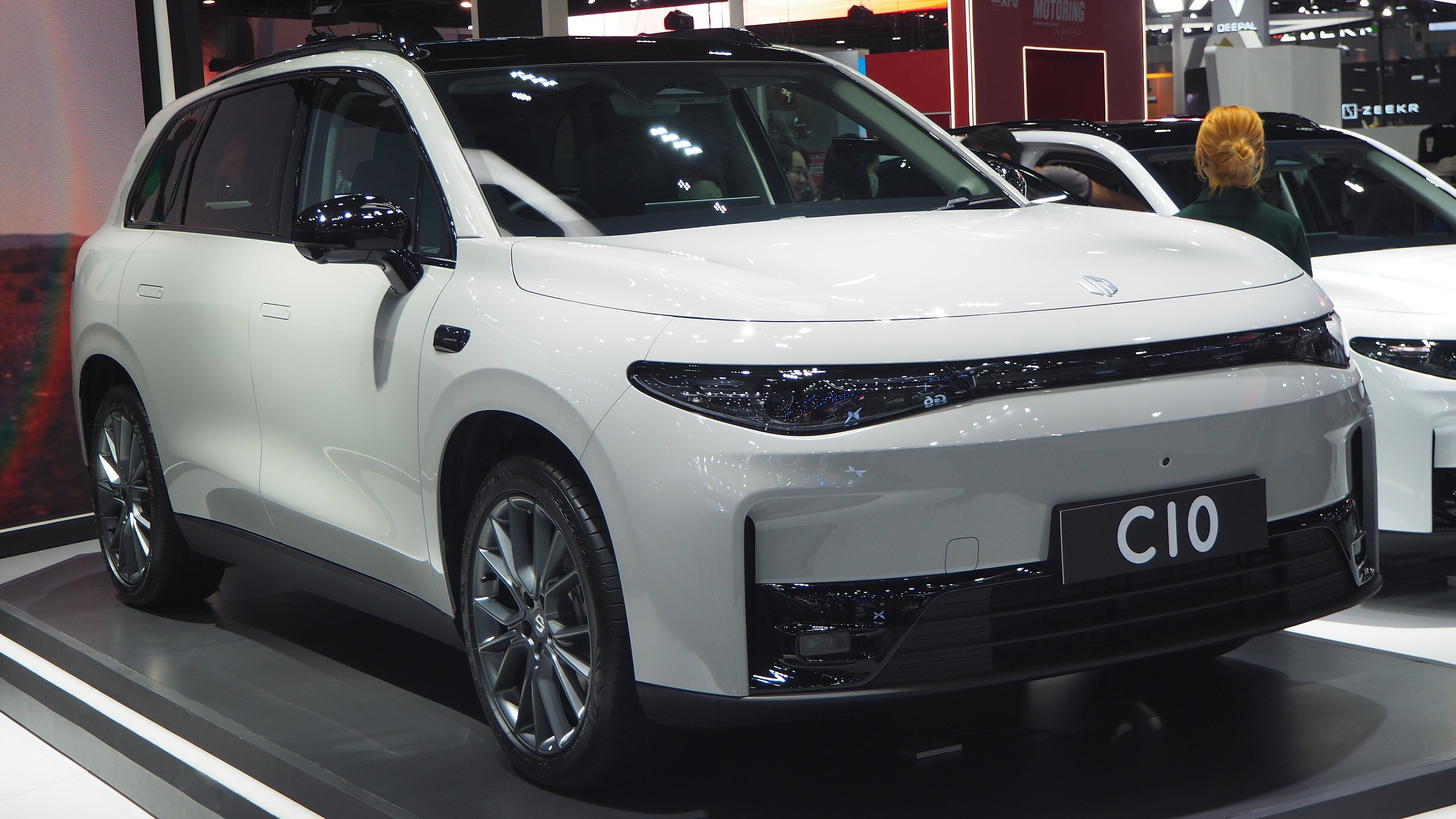White 2024 Leapmotor C10 SUV on a motor show stand, front three-quarter view