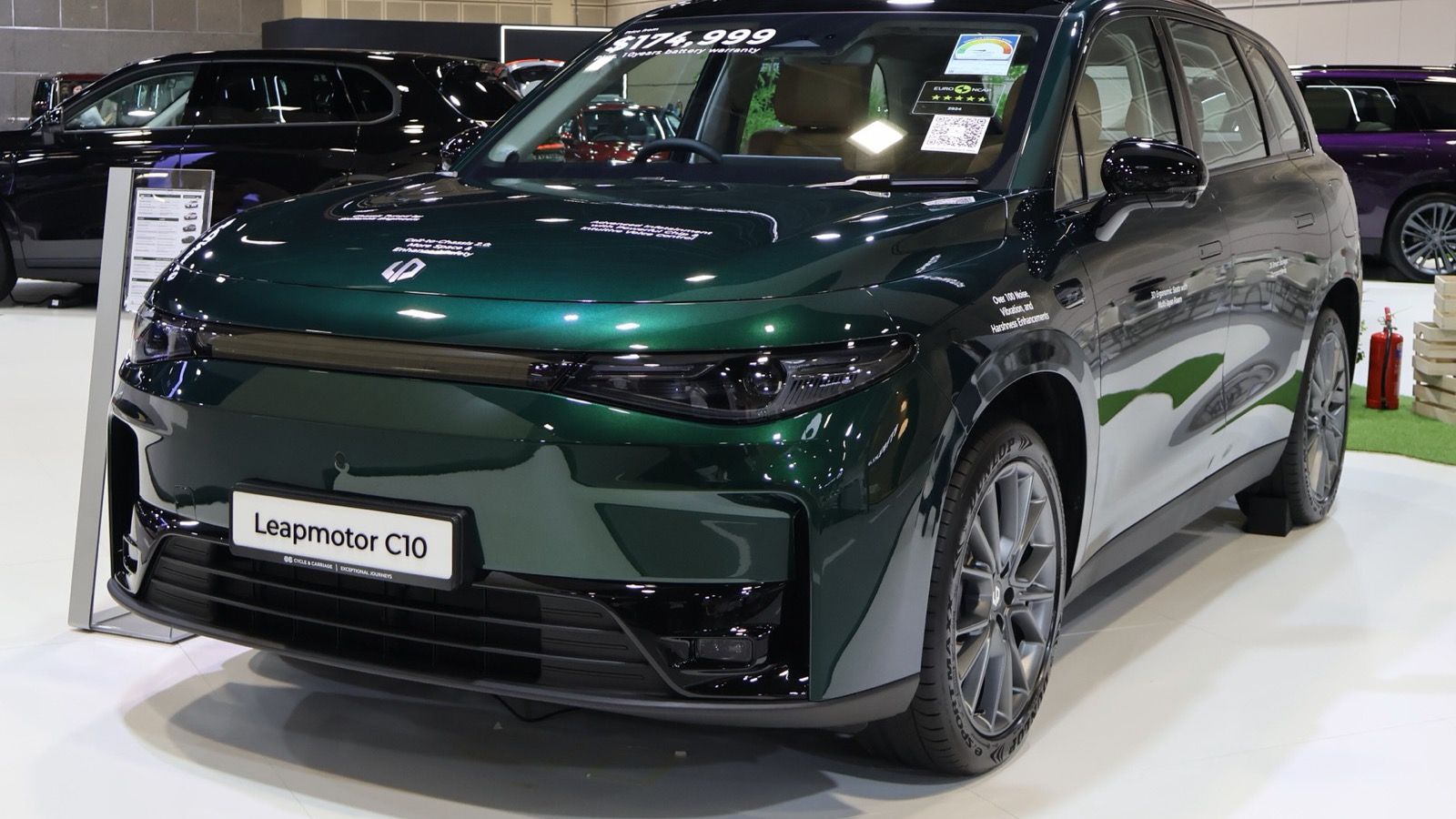 Dark green 2026 Leapmotor C10 SUV on a Singapore motor show stand, front three-quarter view
