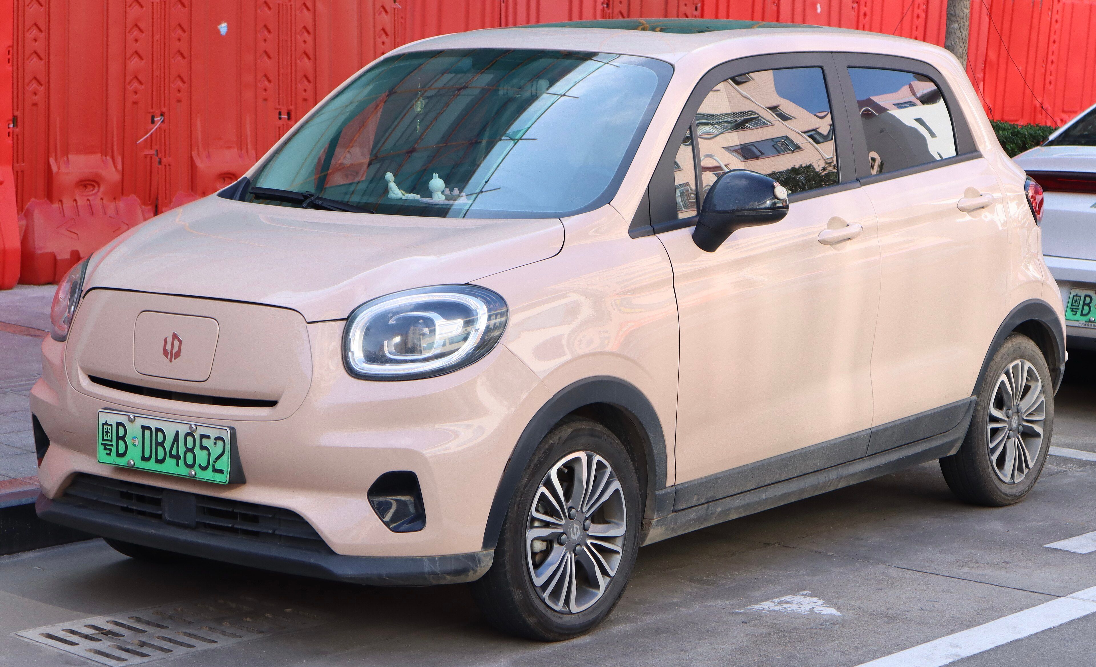 Beige 2020 Leapmotor T03 electric city car, front three-quarter view