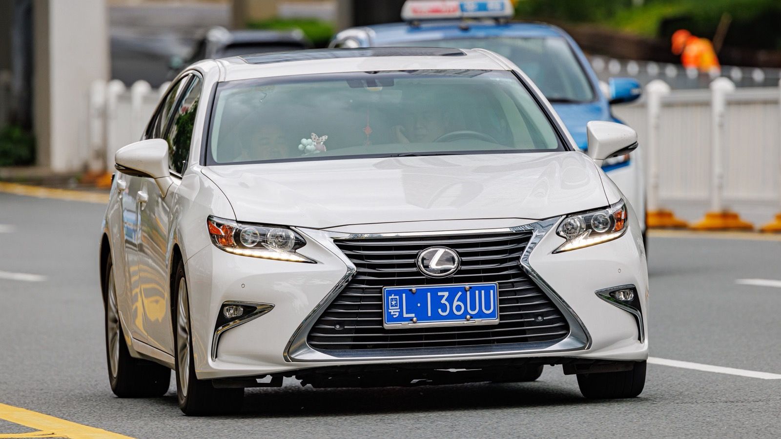 White sixth-generation Lexus ES with spindle grille, front three-quarter view
