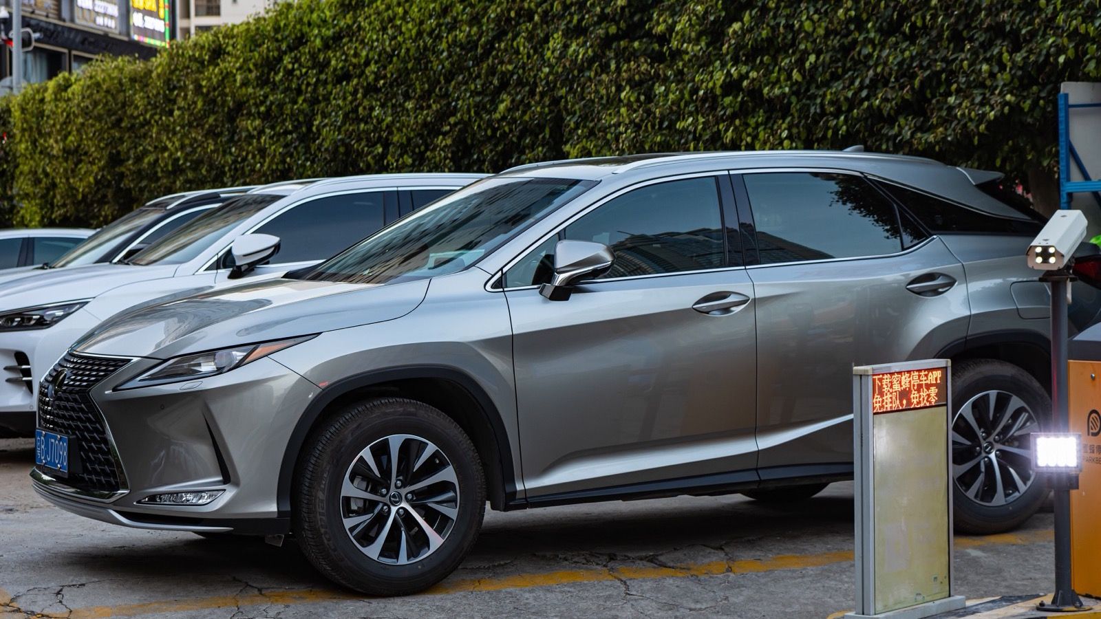 Silver fourth-generation Lexus RX crossover parked, front three-quarter view