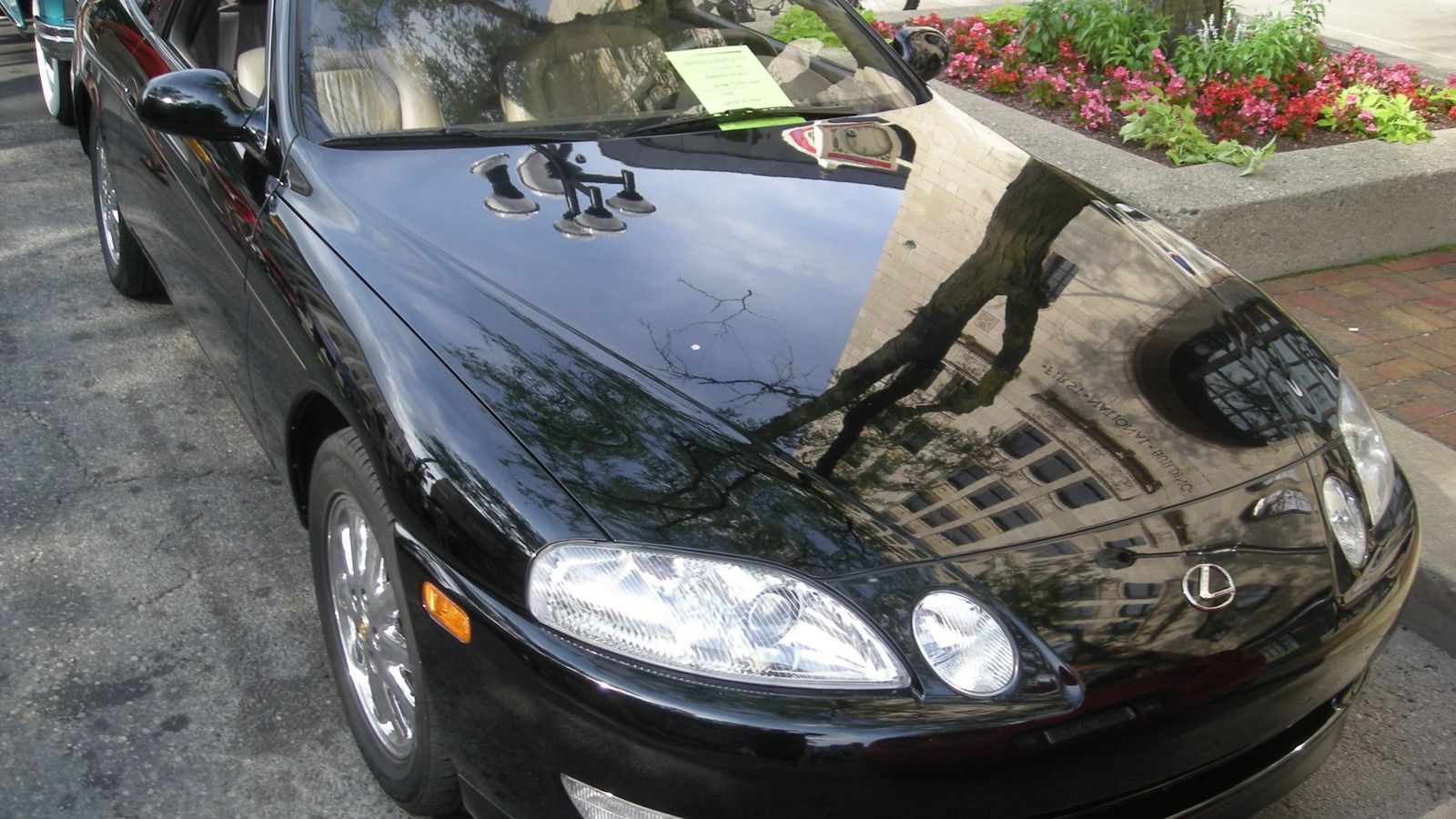 Black 1994 Lexus SC 400 coupe at a car show, front three-quarter view