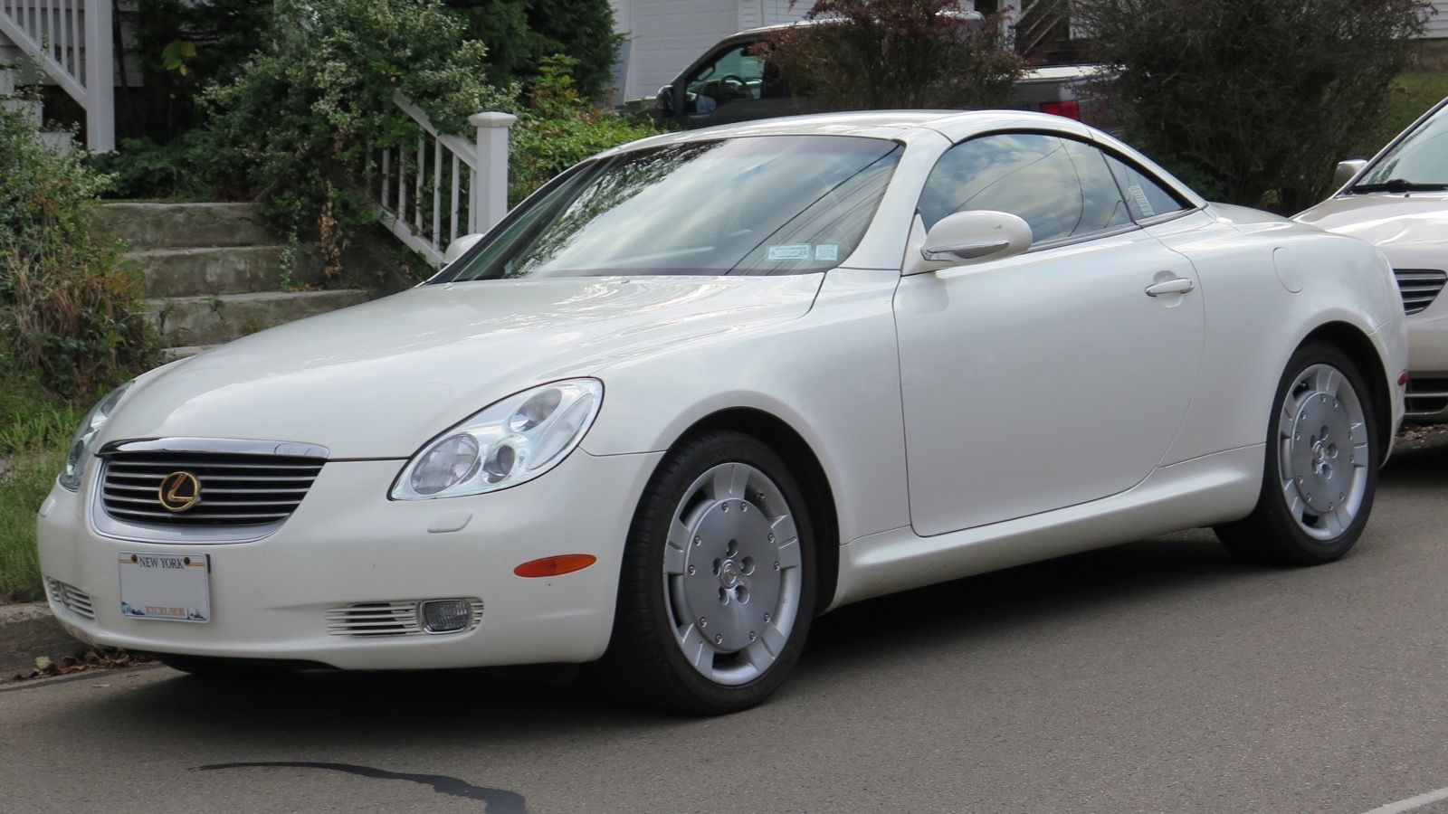 White Gold Crystal 2002 Lexus SC 430 with the hardtop raised, front three-quarter view