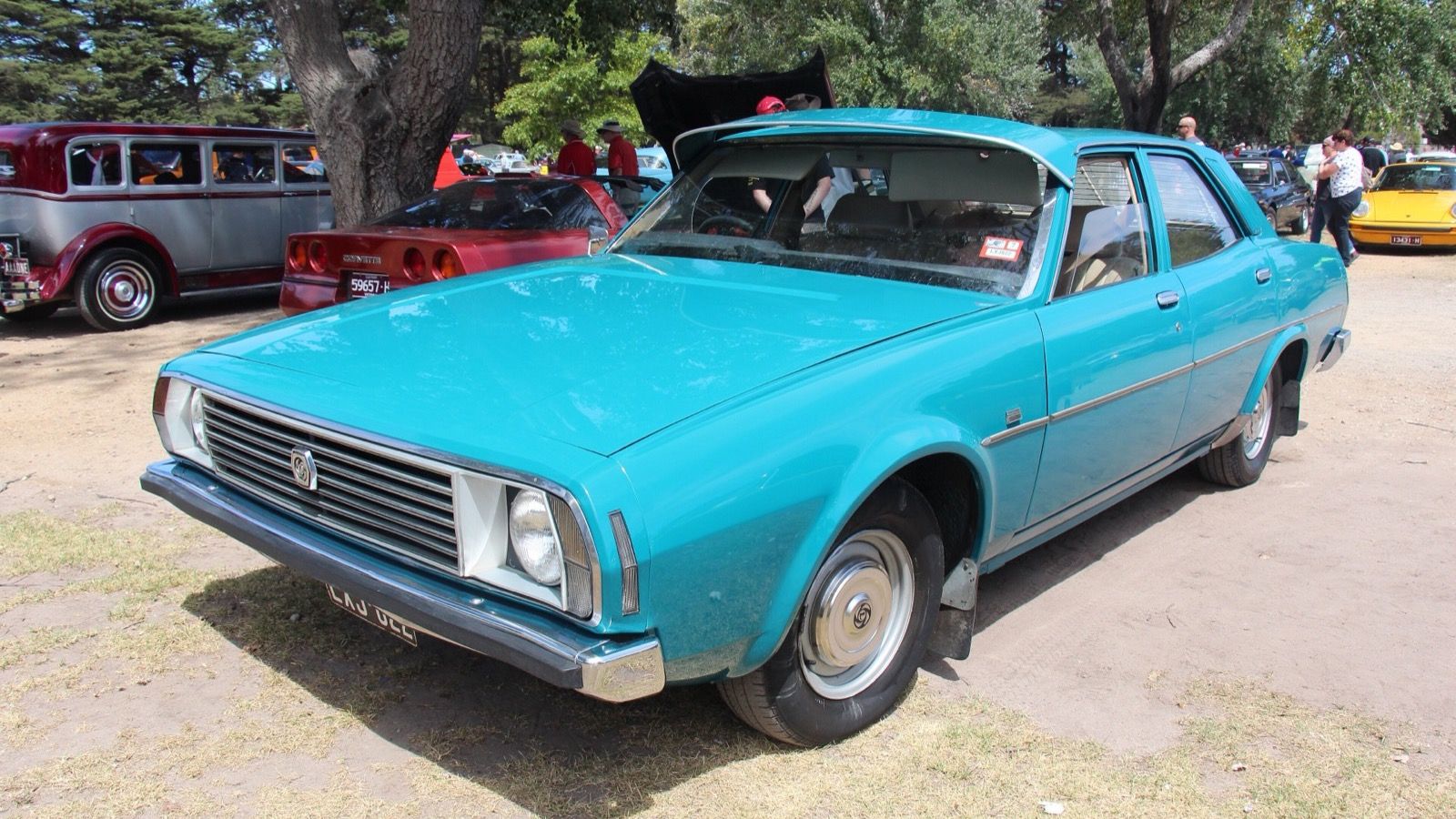 Turquoise Leyland P76 Deluxe four-door sedan, front three-quarter view