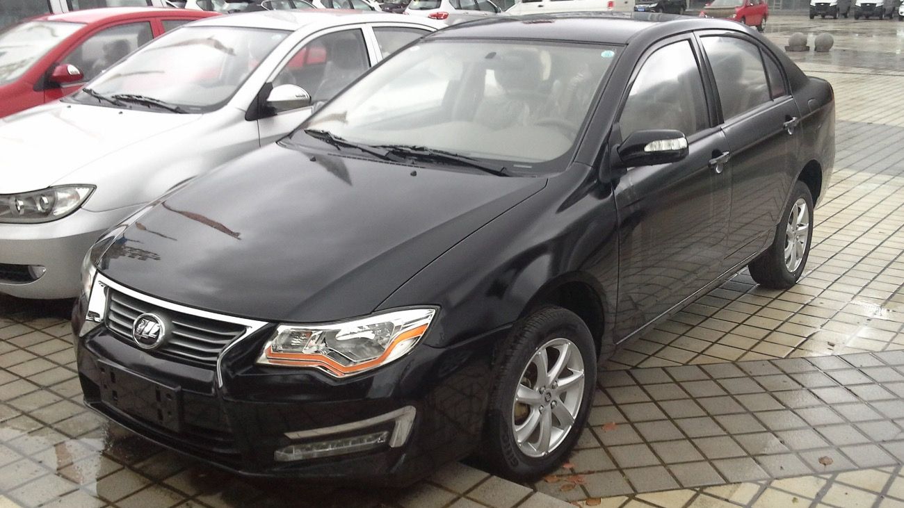 Black Lifan 630 Solano sedan on wet pavement, front three-quarter view