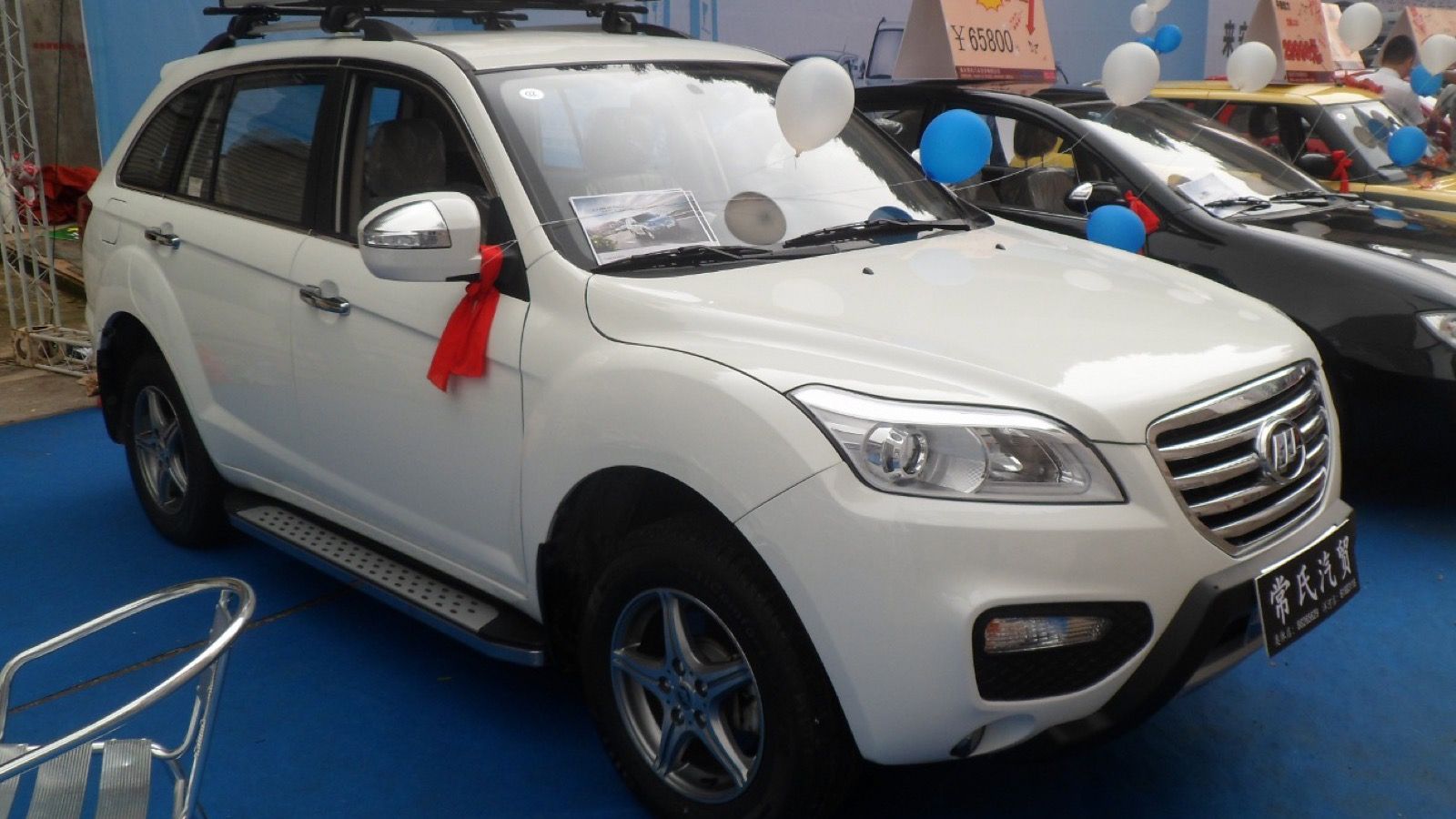 White Lifan X60 crossover on display, front three-quarter view