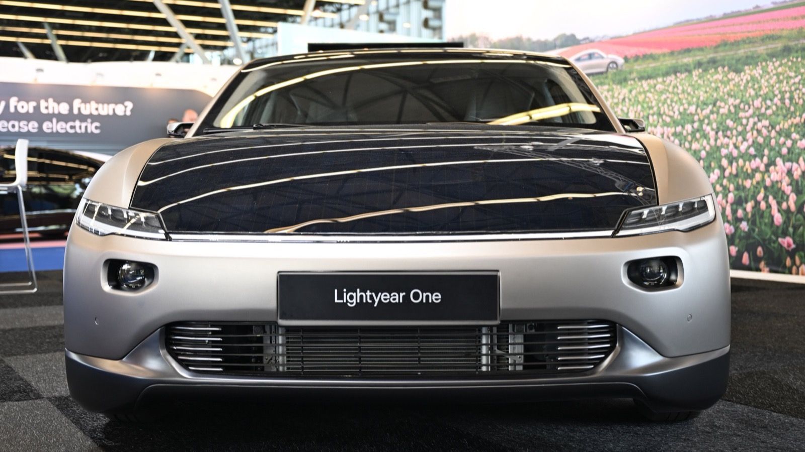 Silver 2022 Lightyear One showing its full-width solar bonnet, head-on front view