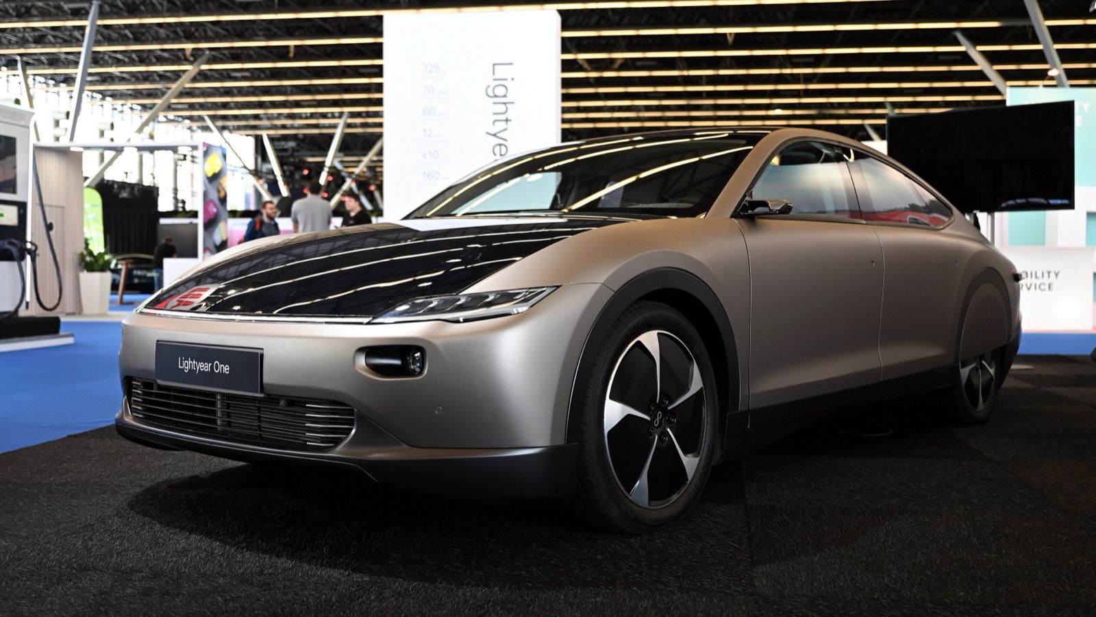 Silver Lightyear One with solar-cell bonnet and roof on display at Fully Charged Live Europe 2022, front three-quarter view