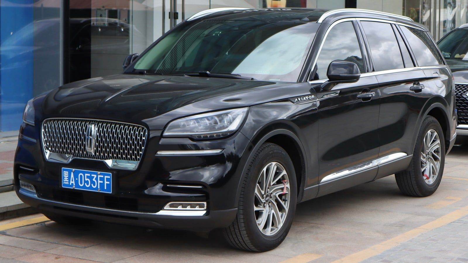 Black Lincoln Aviator, front three-quarter view parked on a city street