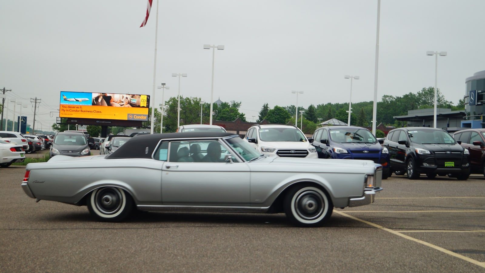 Silver 1969 Lincoln Continental Mark III coupe, side profile view