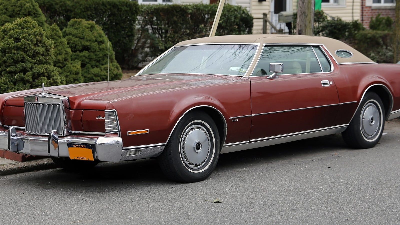Maroon 1973 Lincoln Mark IV coupe, side profile view