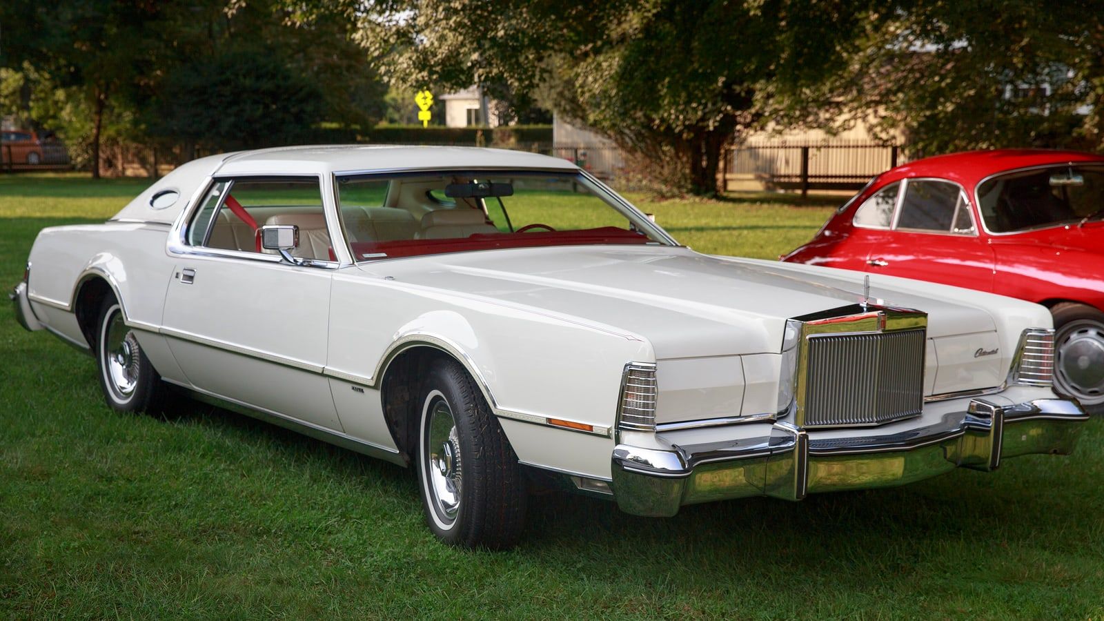 White 1975 Lincoln Continental Mark IV coupe, front three-quarter view on grass
