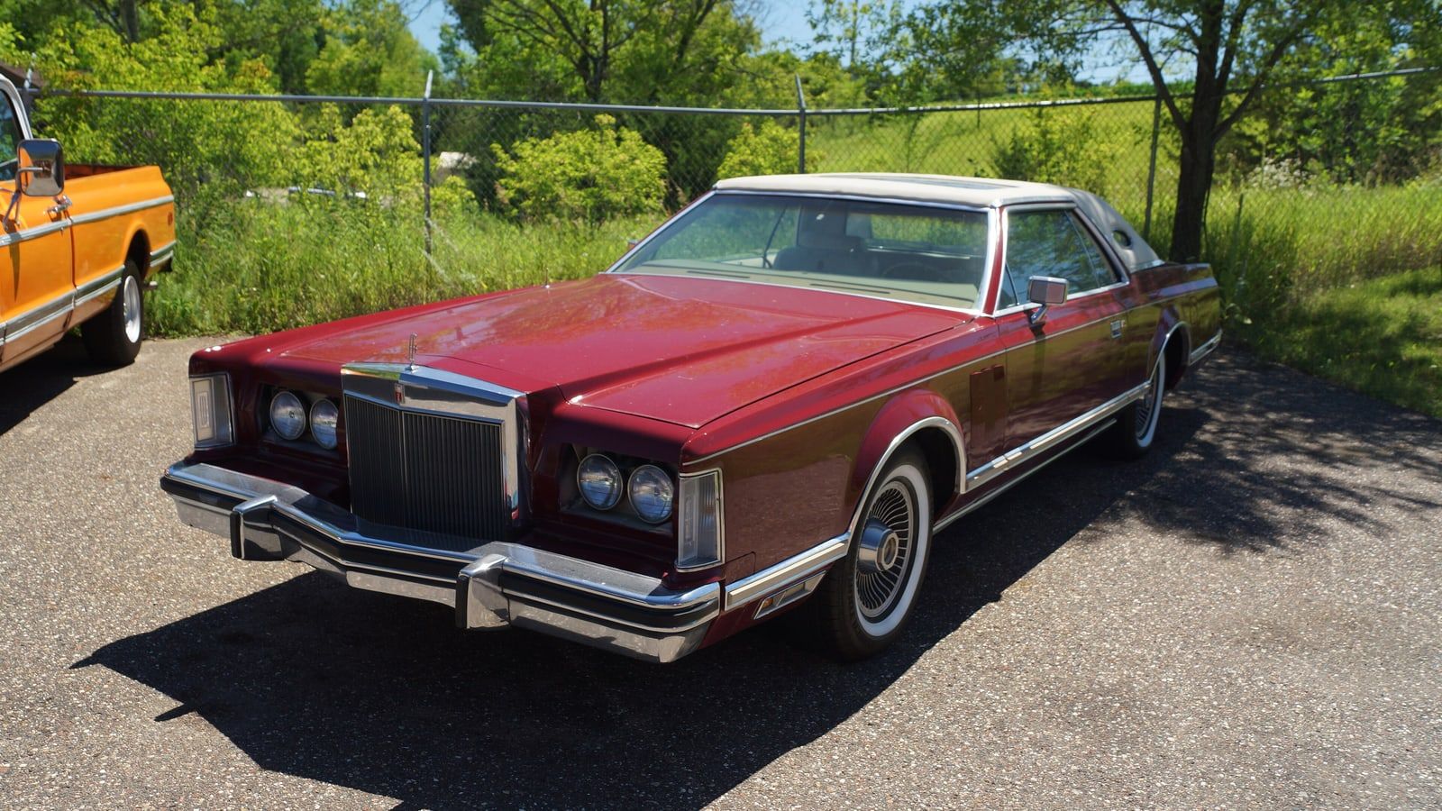 Red 1978 Lincoln Continental Mark V coupe, front three-quarter view