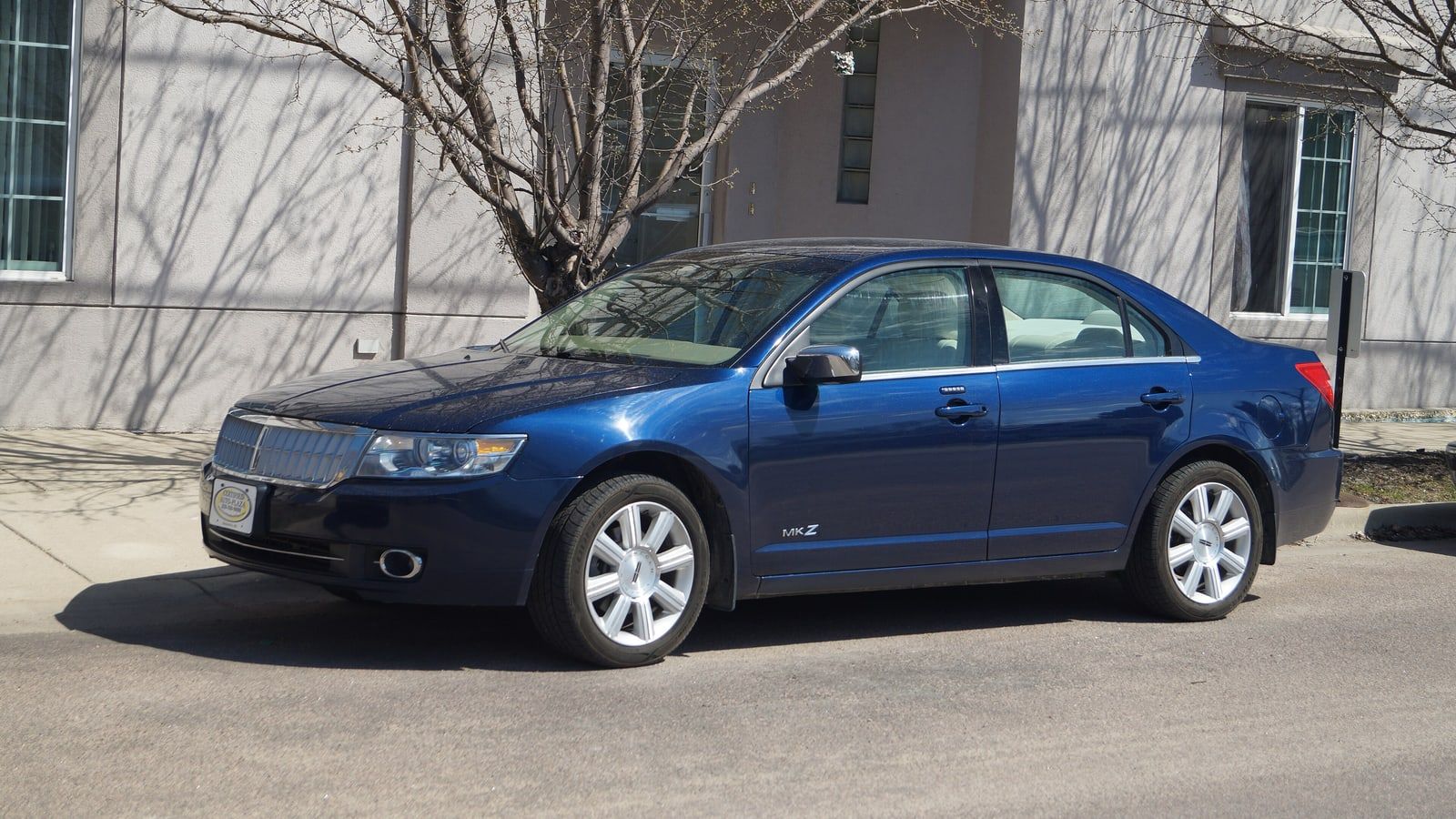 Dark blue 2007 Lincoln MKZ sedan, front three-quarter view on a street