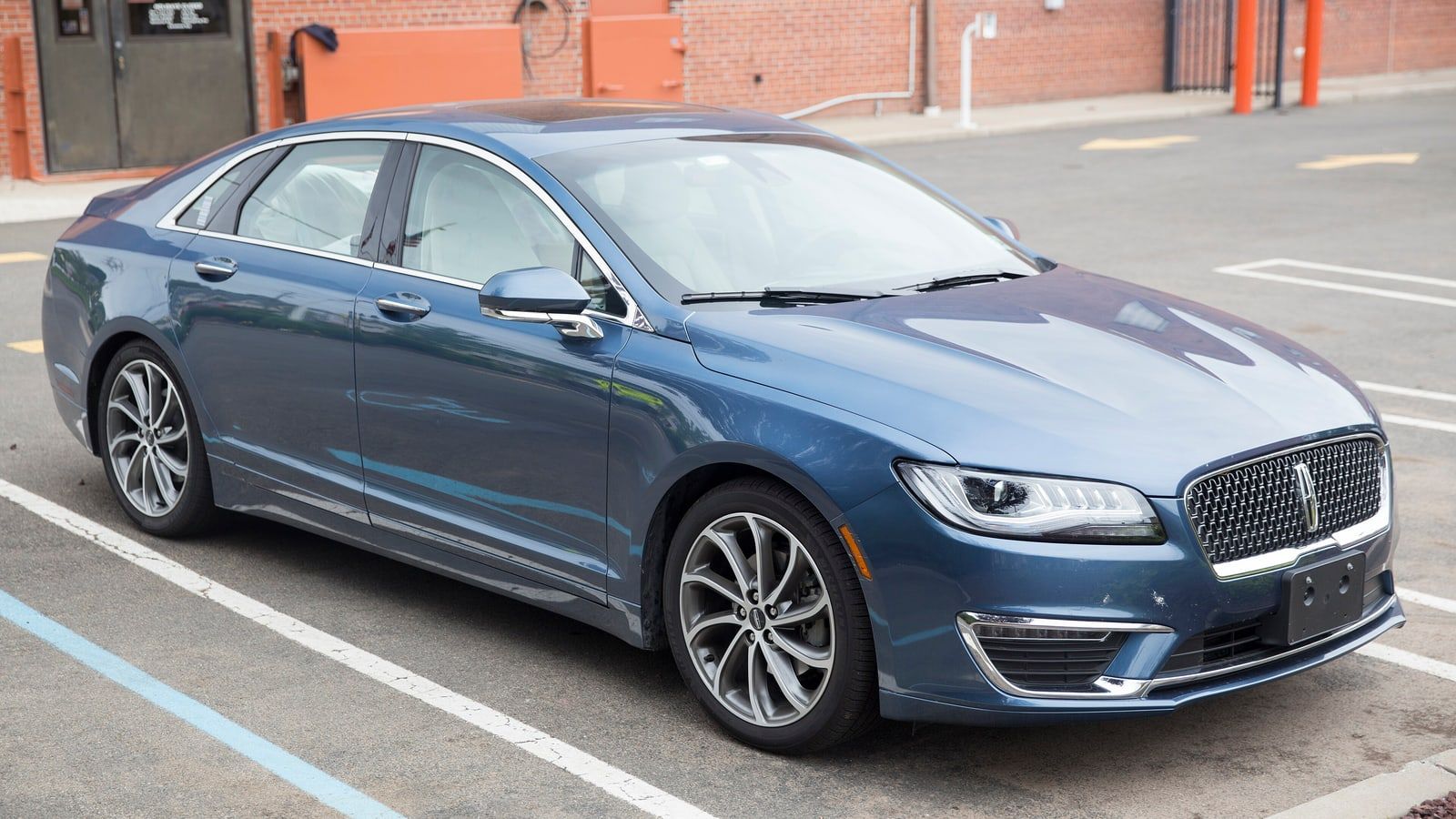 Blue 2019 Lincoln MKZ Reserve, front three-quarter view in a parking lot