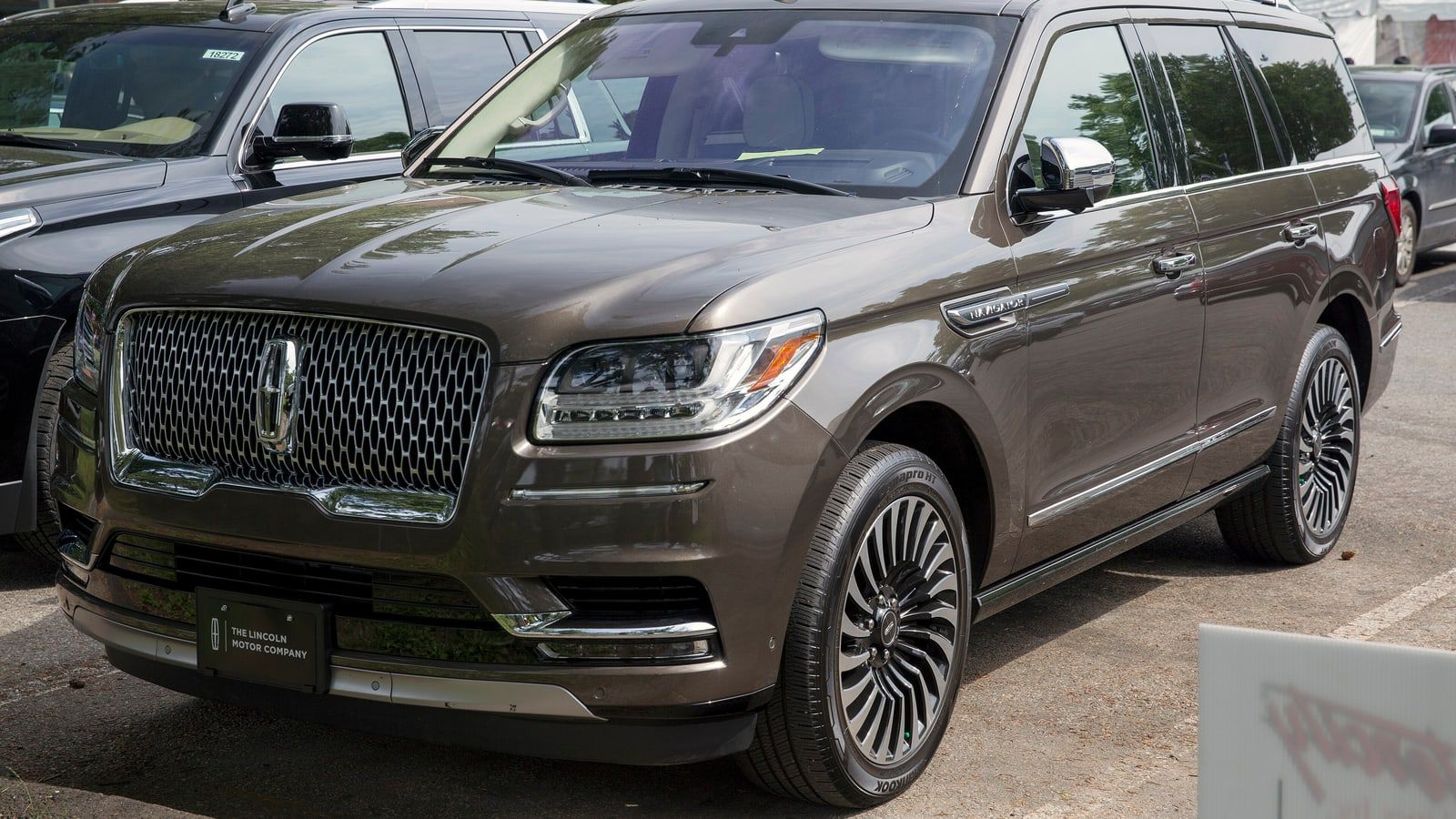 Brown 2018 Lincoln Navigator, front three-quarter view