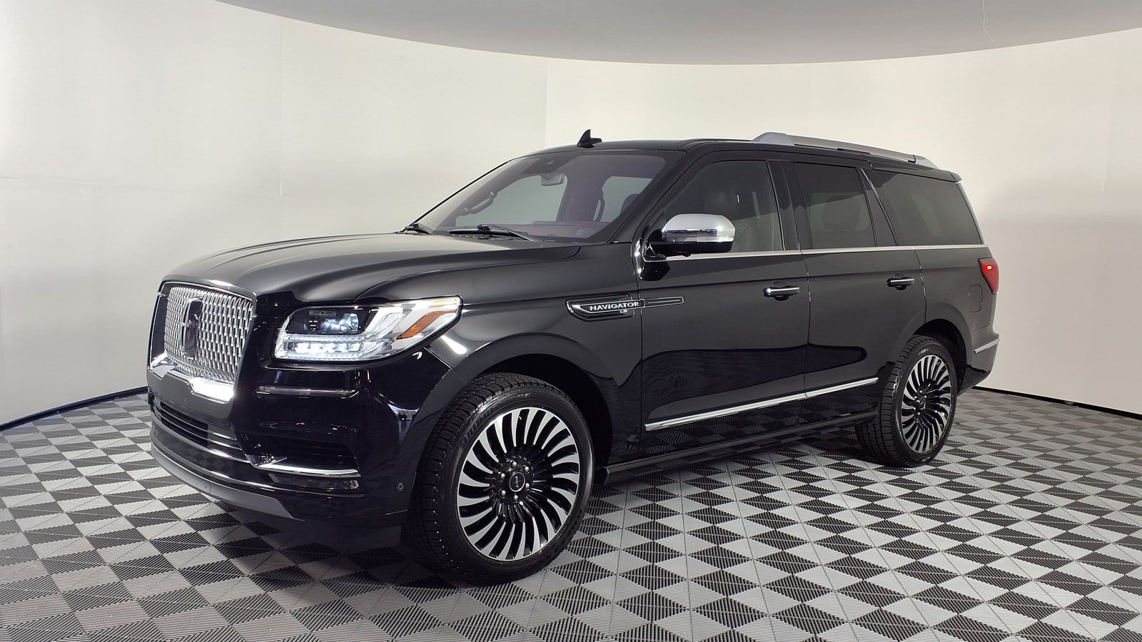 Black 2020 Lincoln Navigator Black Label, front three-quarter view in a studio
