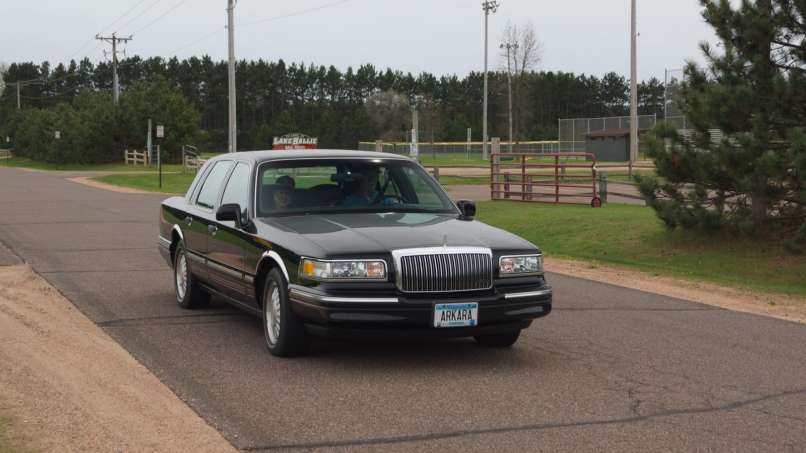 Grey 1996 Lincoln Town Car sedan, front three-quarter view on a road