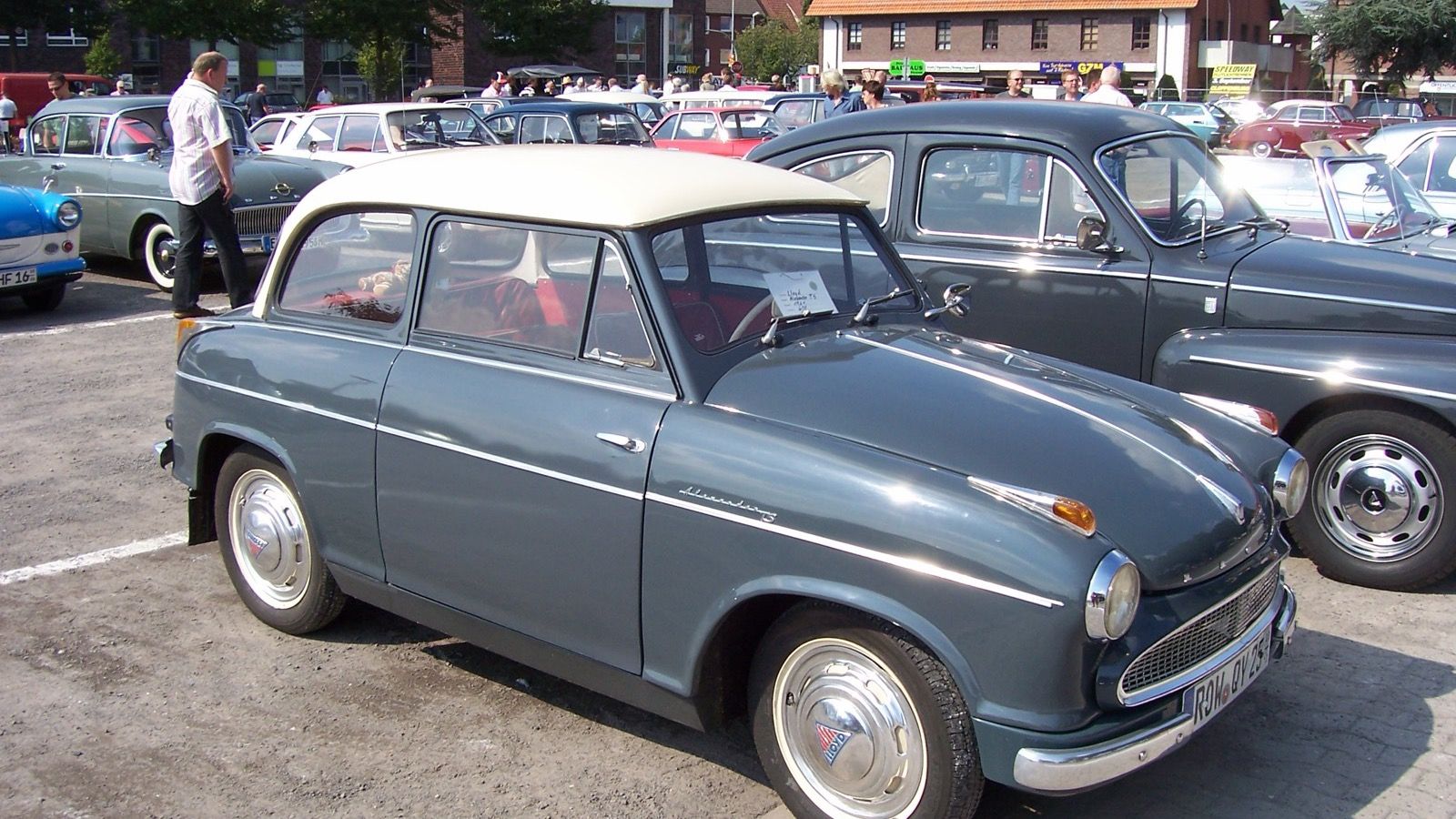 Grey 1961 Lloyd Alexander TS with cream roof at an outdoor classic car meet, front three-quarter view