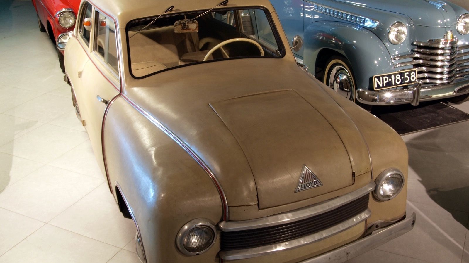 Beige 1951 Lloyd LP 300 on museum display, front three-quarter view