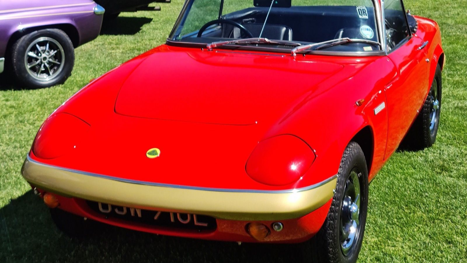 Red 1972 Lotus Elan Sprint drophead coupe, front three-quarter view.