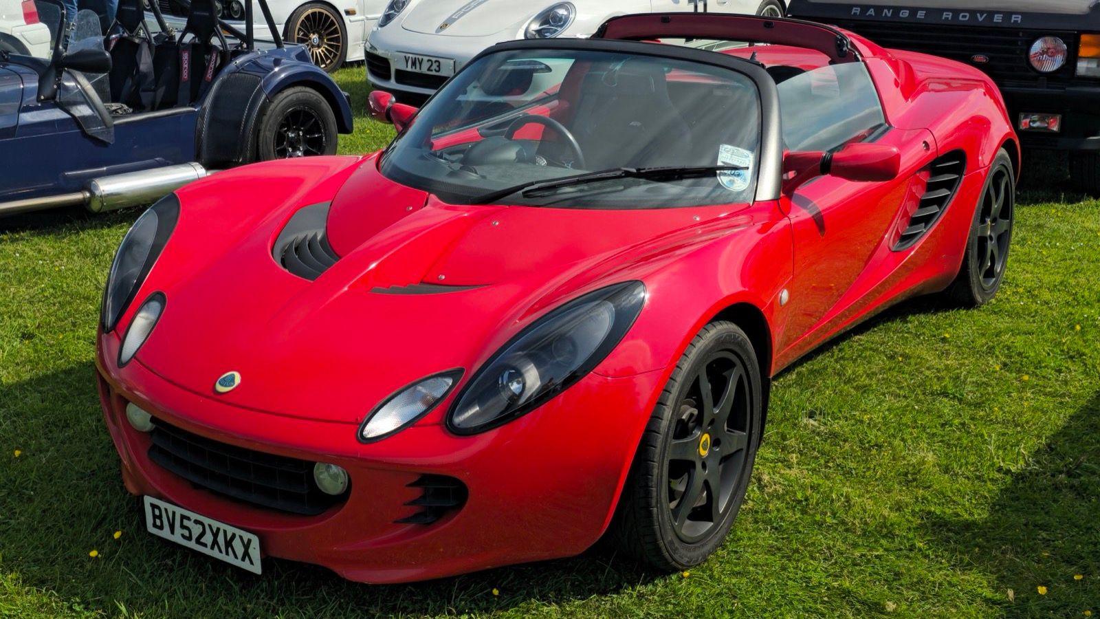 Red 2002 Lotus Elise Series 2, front three-quarter view.
