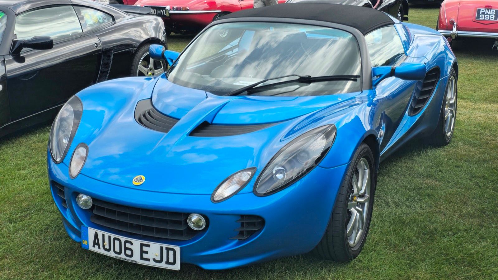 Blue 2006 Lotus Elise 111R, front three-quarter view.