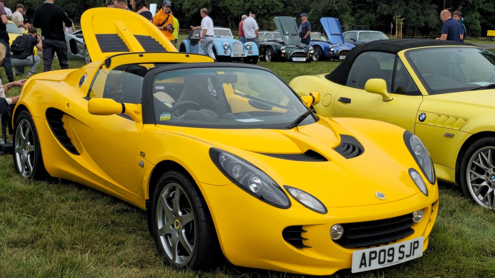Yellow 2009 Lotus Elise S Touring, front three-quarter view.