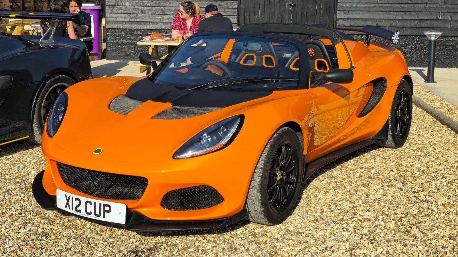Orange 2019 Lotus Elise Cup 250, front three-quarter view.