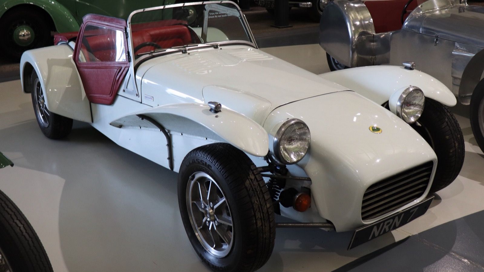 White 1969 Lotus Seven S3 1.6 on museum display, front three-quarter view.