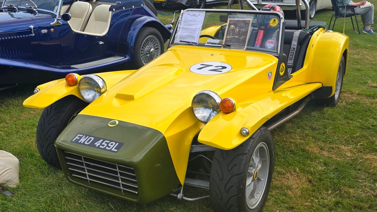 Yellow 1972 Lotus Seven Series 4 with squarer fibreglass body, front three-quarter view.