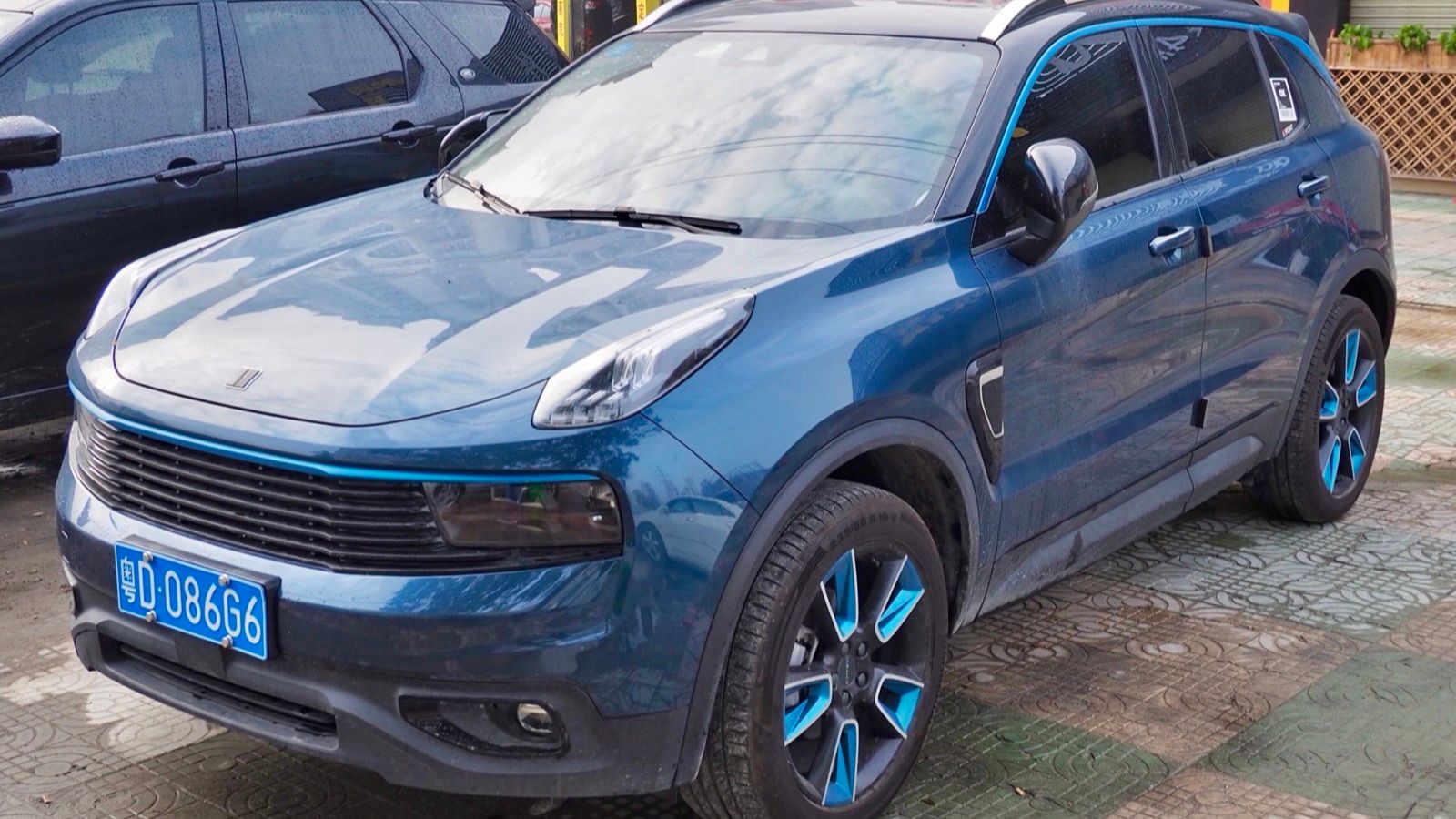 Blue 2017 Lynk & Co 01 parked on a street, front three-quarter view