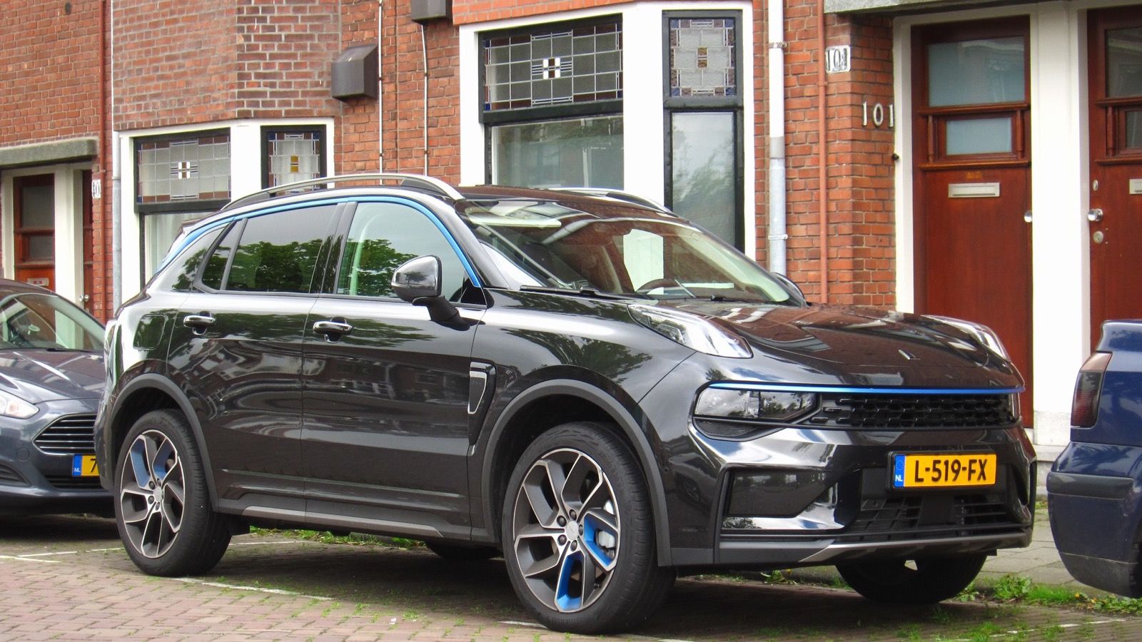 Black 2021 Lynk & Co 01 1.5T plug-in hybrid parked in the Netherlands, front three-quarter view