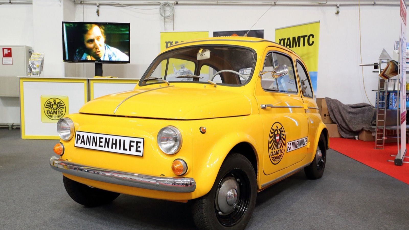 Yellow 1965 Puch 500 in Austrian ÖAMTC breakdown-service livery, front three-quarter view