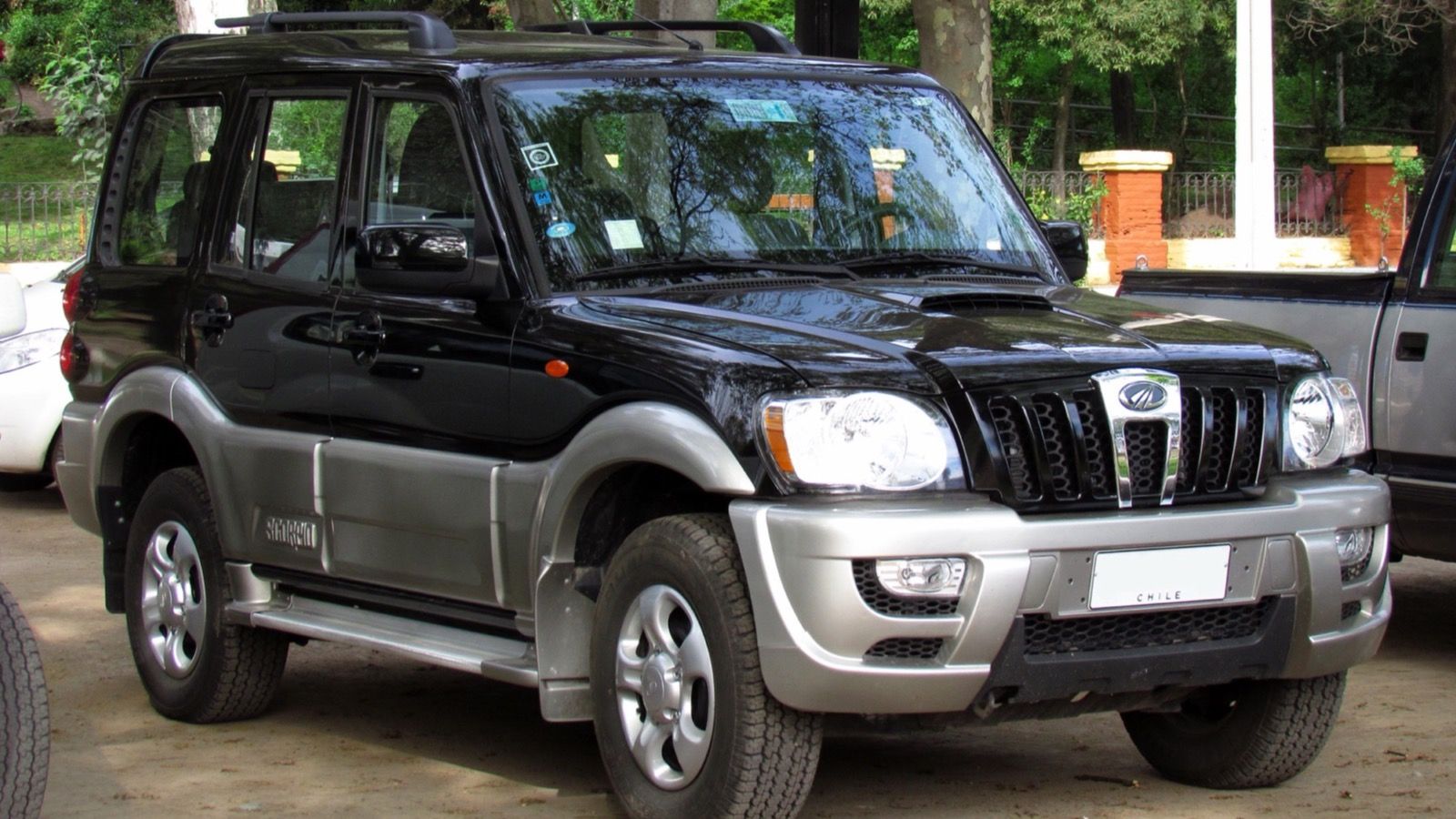Black 2011 Mahindra Scorpio GLX 2.6 m-Hawk with silver lower cladding, front three-quarter view