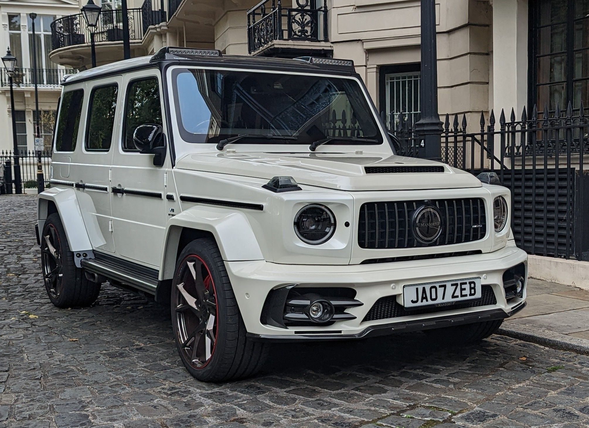 White wide-body Mansory Gronos on the W464 Mercedes-AMG G 63, front three-quarter view