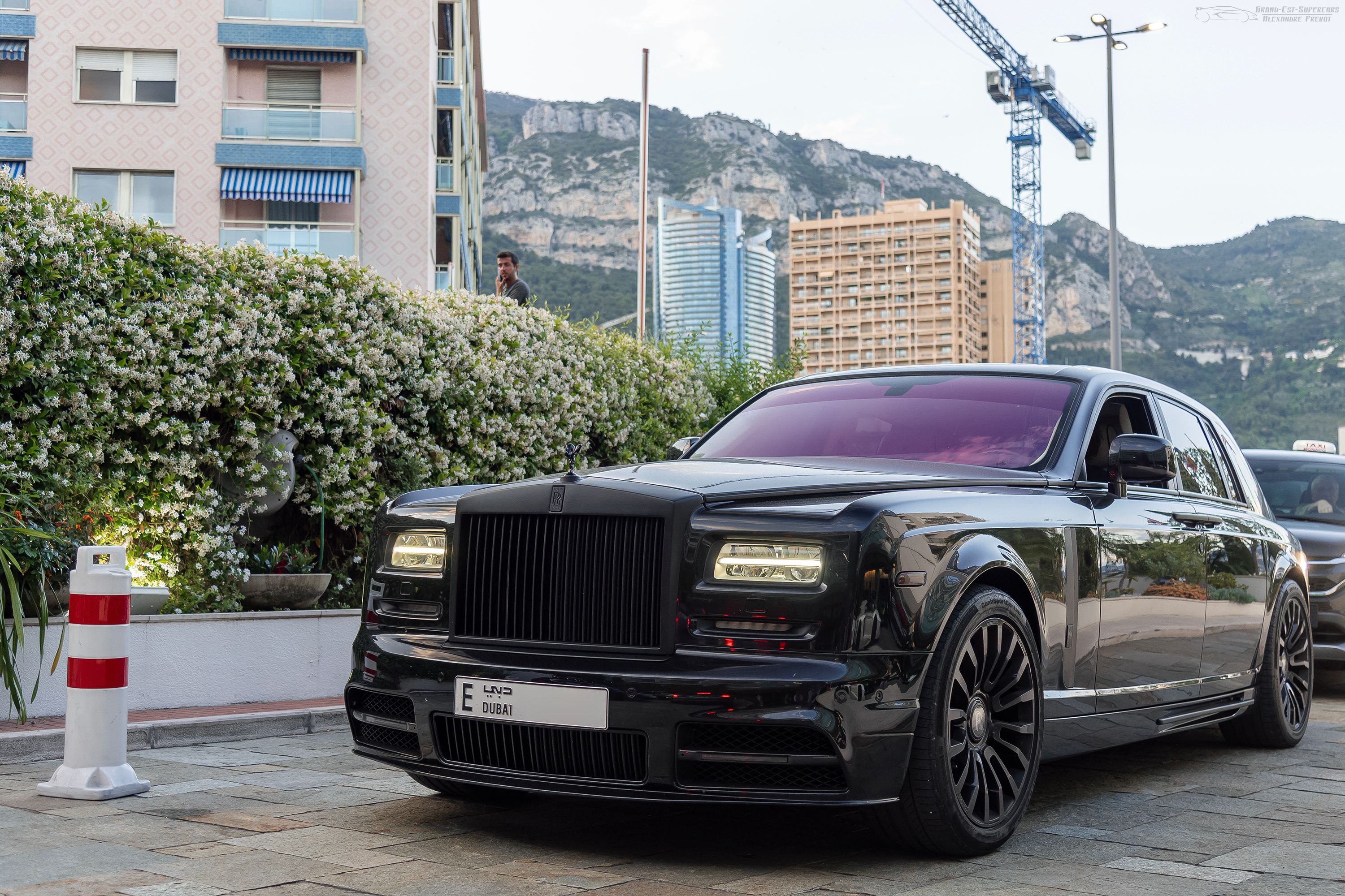 Black wide-body Mansory Conquistador on the Rolls-Royce Phantom Series II in Monaco, front three-quarter view