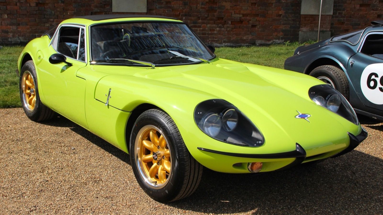 Lime green Marcos GT 1600 coupe, front three-quarter view
