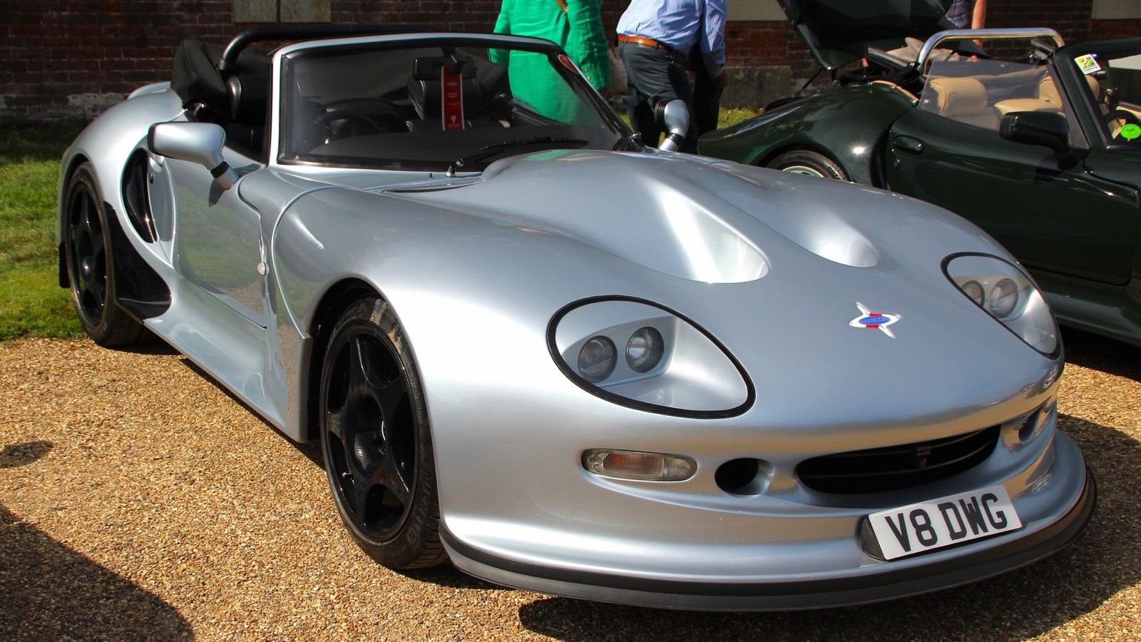 Silver 1999 Marcos Mantis GT with the roof down, front three-quarter view