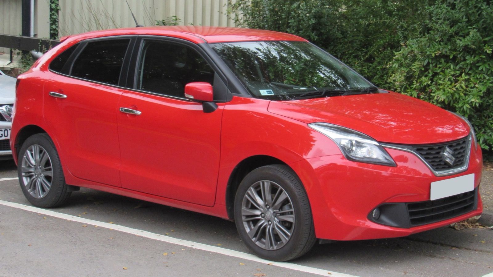 Red 2016 Suzuki Baleno Boosterjet hatchback, front three-quarter view