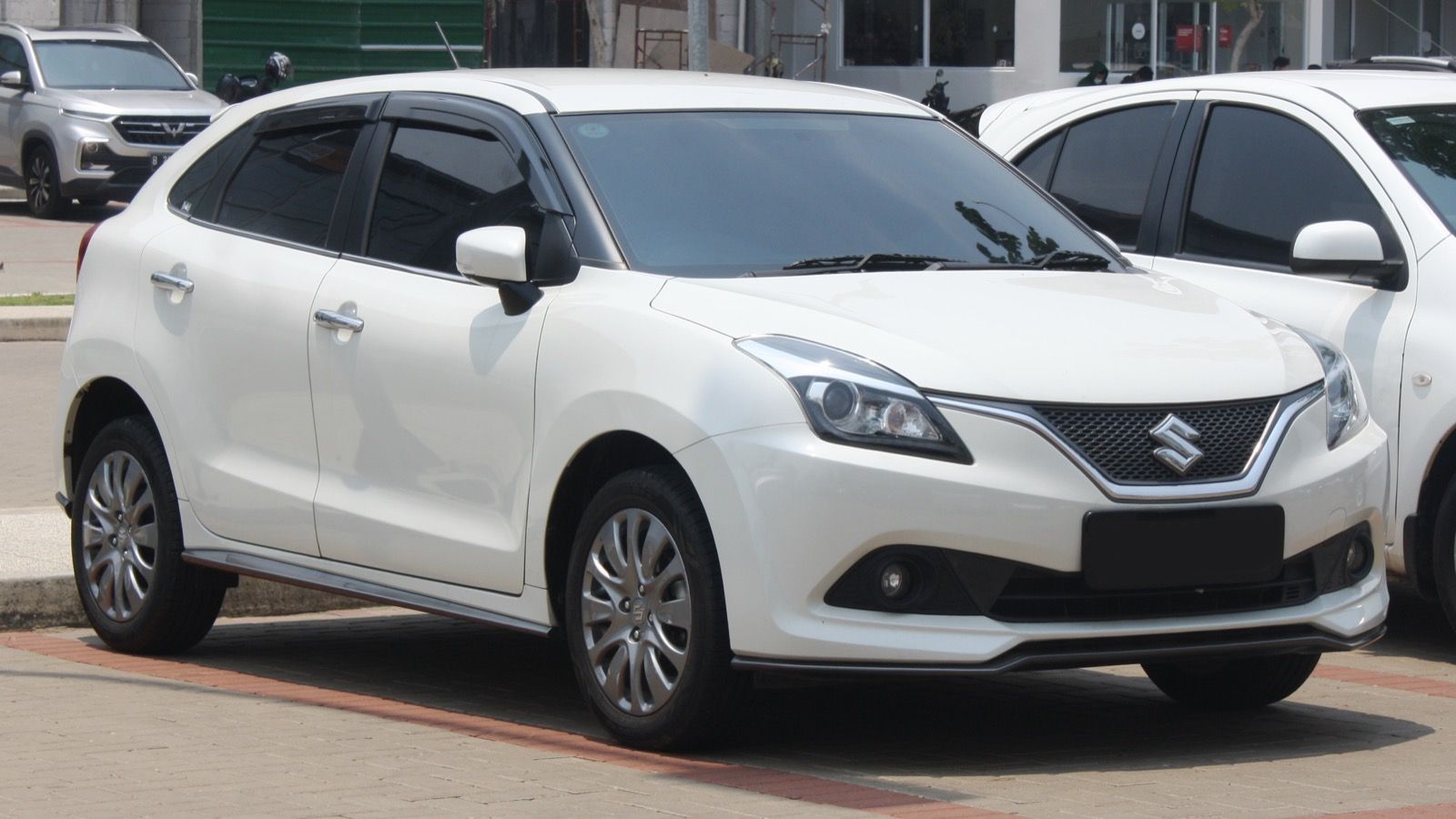 White 2019 Suzuki Baleno hatchback, front three-quarter view