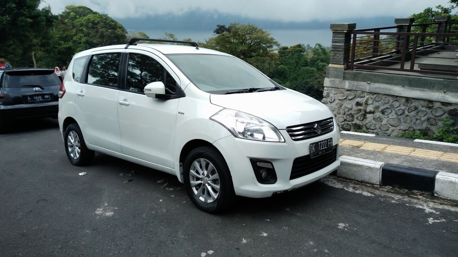 White 2013 Suzuki Ertiga GL compact MPV, front three-quarter view