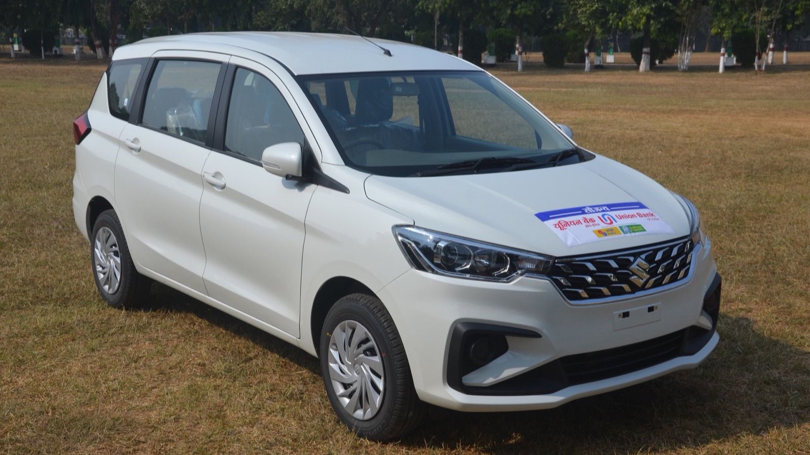 White 2022 Maruti Suzuki Ertiga LXi compact MPV, front three-quarter view