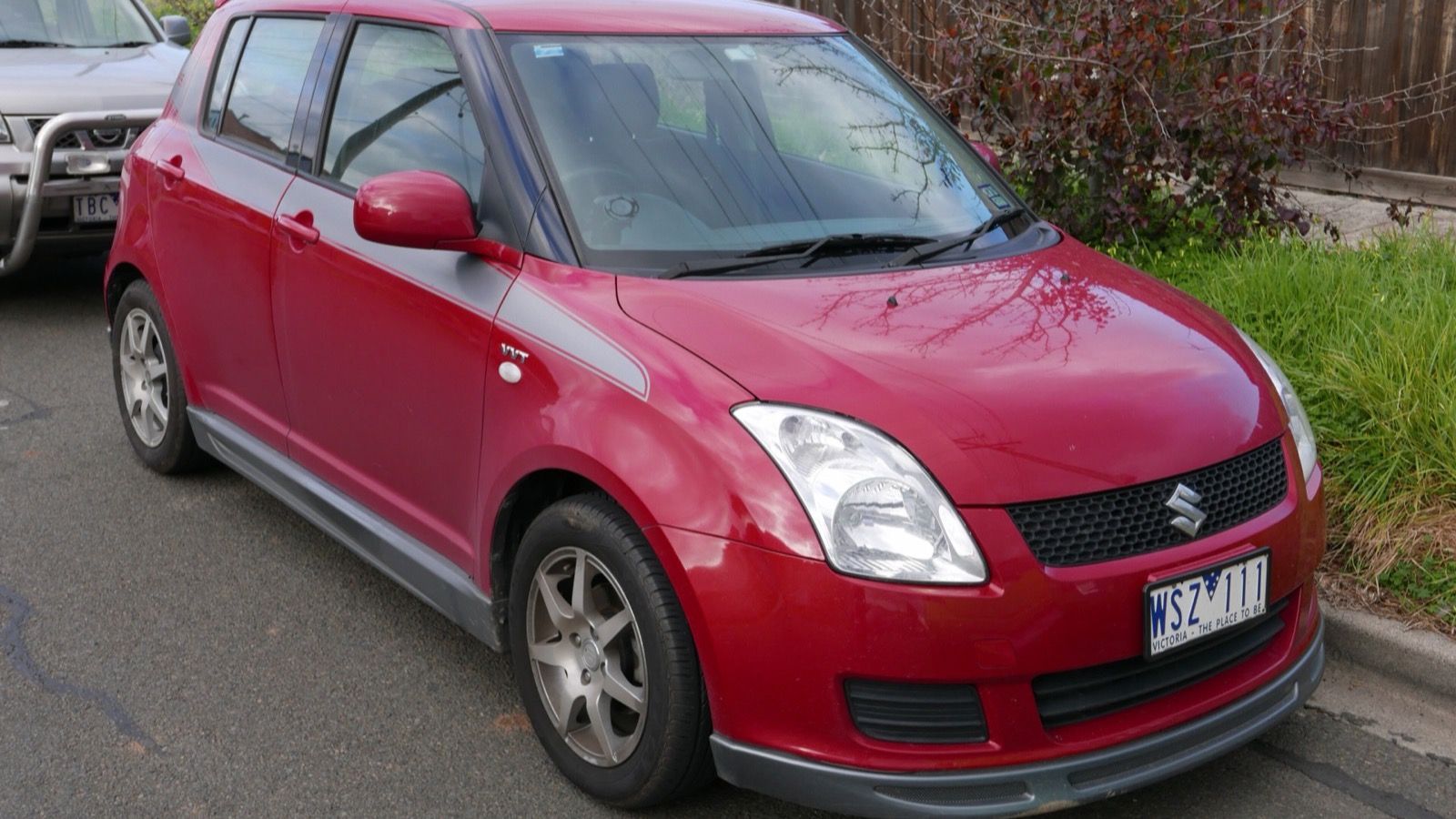 Red 2008 Suzuki Swift five-door hatchback, front three-quarter view