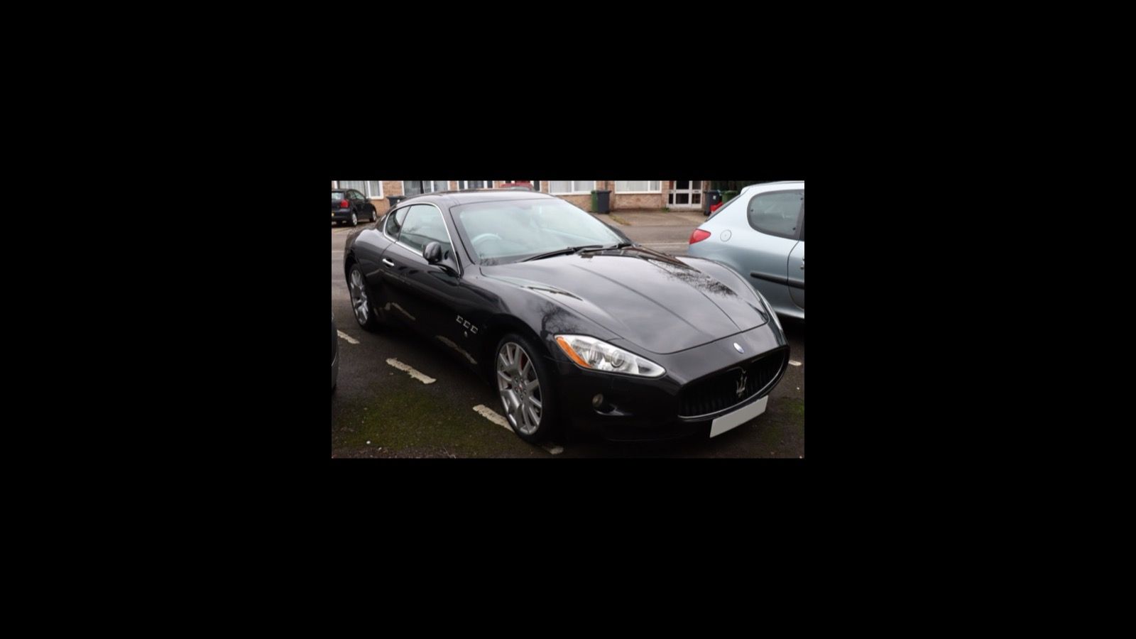 Black 2007 Maserati GranTurismo V8 coupe, front three-quarter view