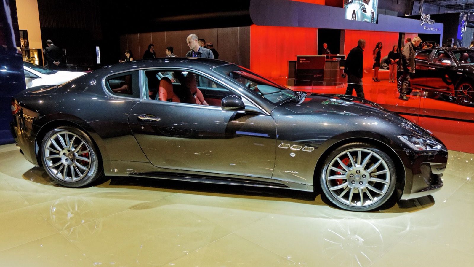 Dark grey 2012 Maserati GranTurismo Sport coupe at the Paris Motor Show, side profile