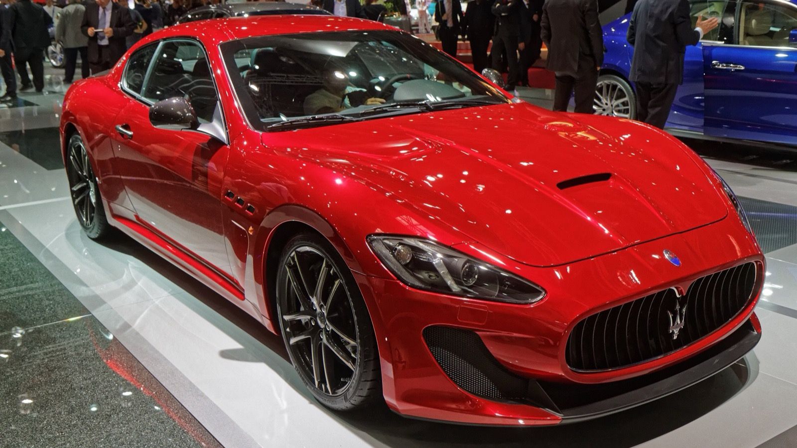 Red 2014 Maserati GranTurismo MC Stradale coupe at the Paris Motor Show, front three-quarter view